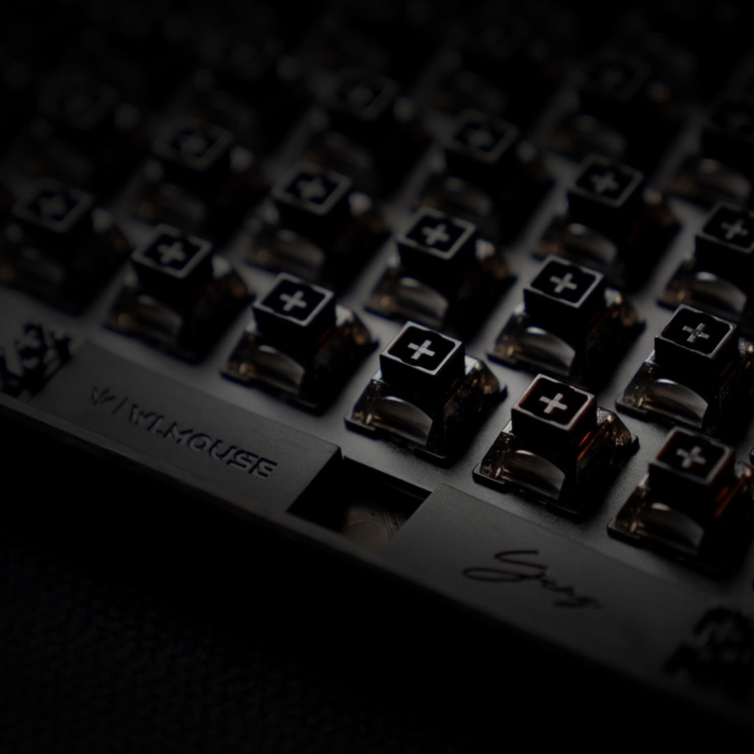 YING75 Forged Carbon Fiber Keyboard close-up showing key switches and WLMOUSE branding, highlighting its sleek design.